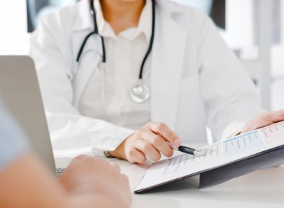 young-asia-female-doctor-in-white-medical-uniform-using-clipboard-is-delivering-great-news-talk-discuss-results 2.jpg